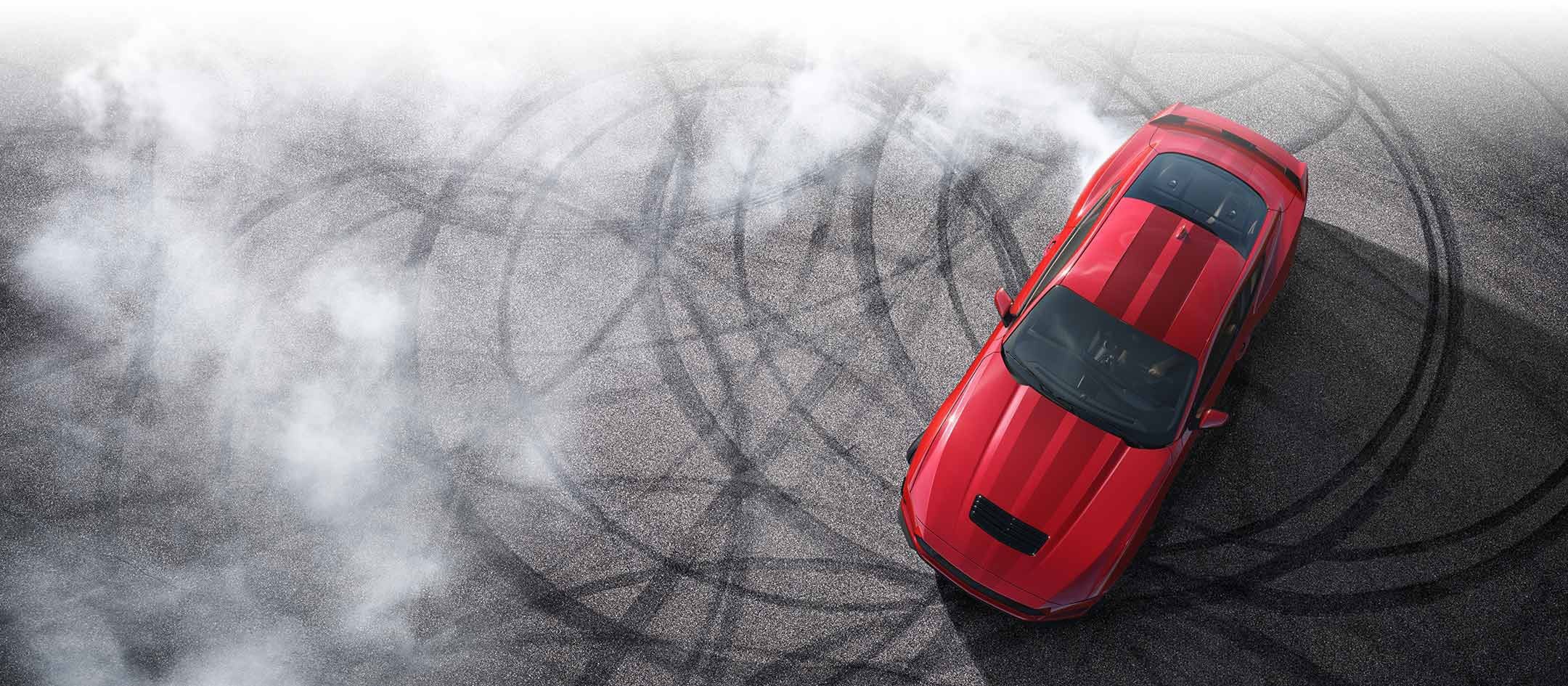 Overhead view of a 2024 Ford Mustang® model with tire tracks on pavement | Bergstrom Ford of Oshkosh in Oshkosh WI
