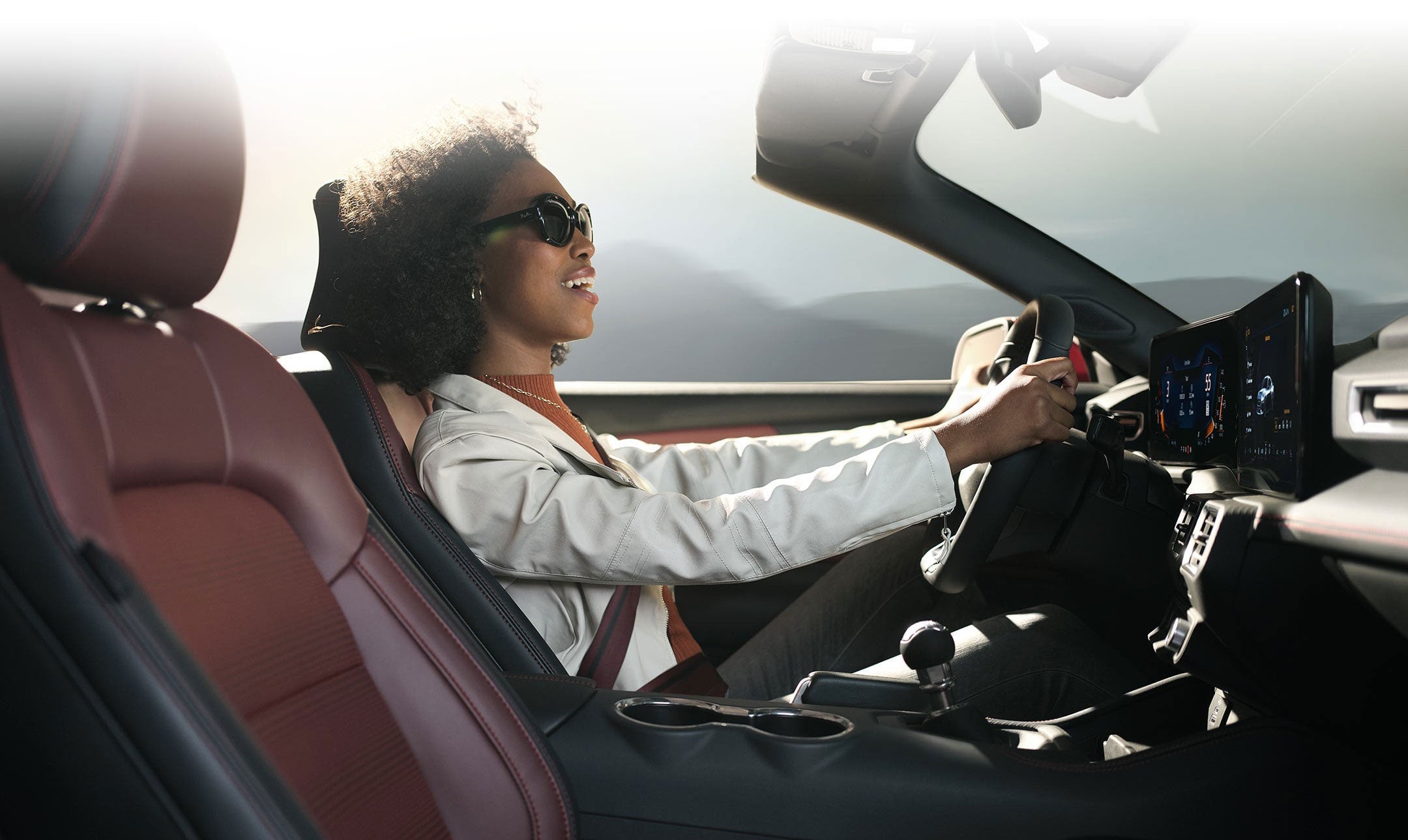 Person sitting in the driver’s seat of a 2024 Ford Mustang® convertible | Bergstrom Ford of Oshkosh in Oshkosh WI