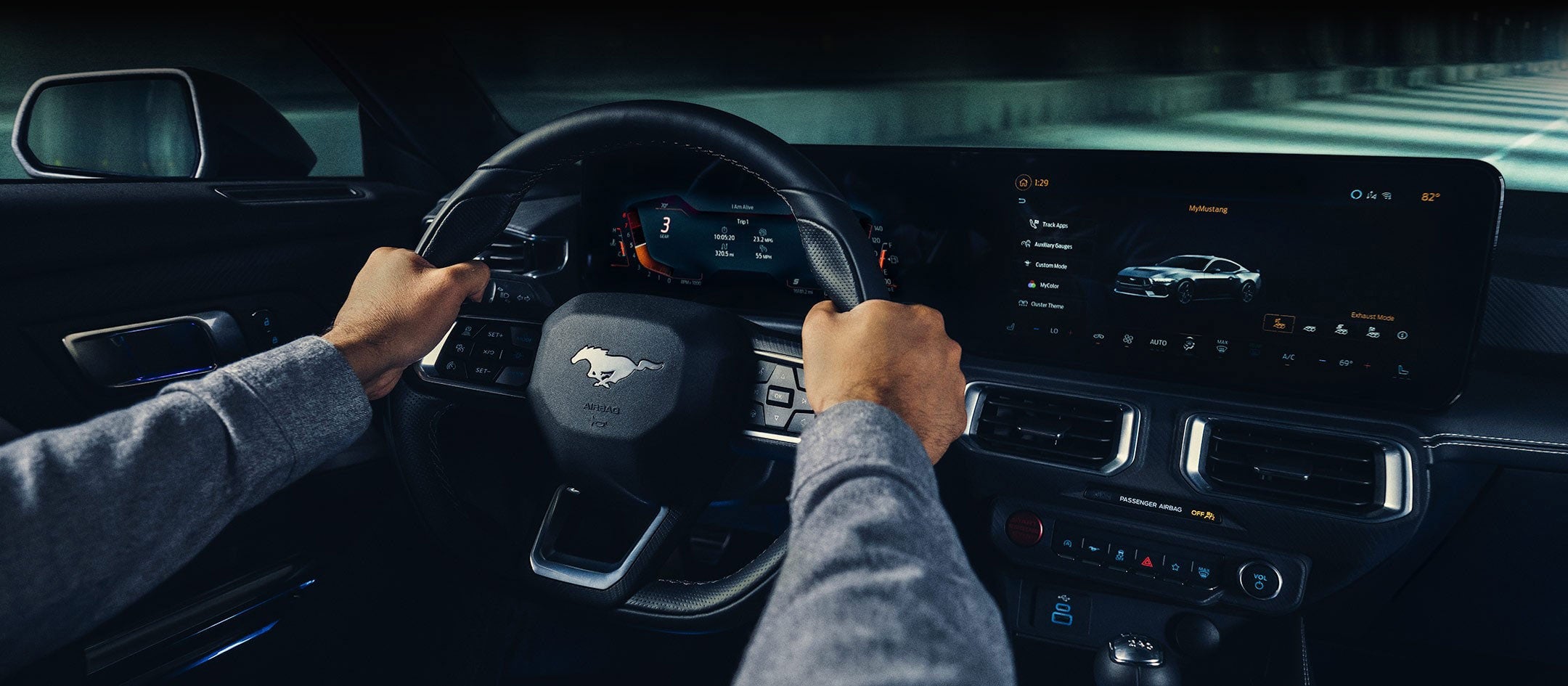 A 2024 Ford Mustang® model interior with a person driving | Bergstrom Ford of Oshkosh in Oshkosh WI